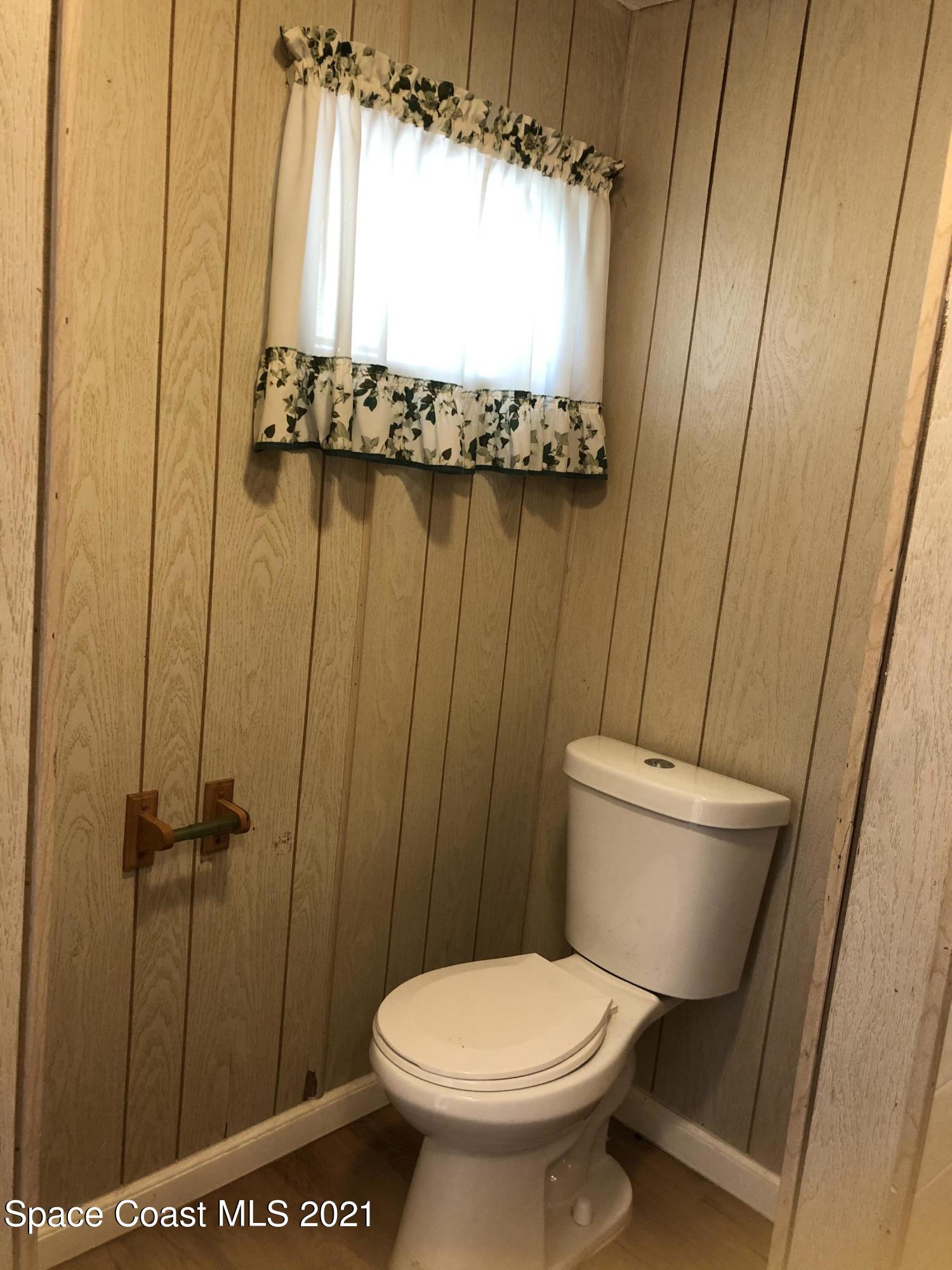 401 Hawk Drive Sebastian, FL 32976 - Photo 11 of 23 a bathroom with a toilet and a shower