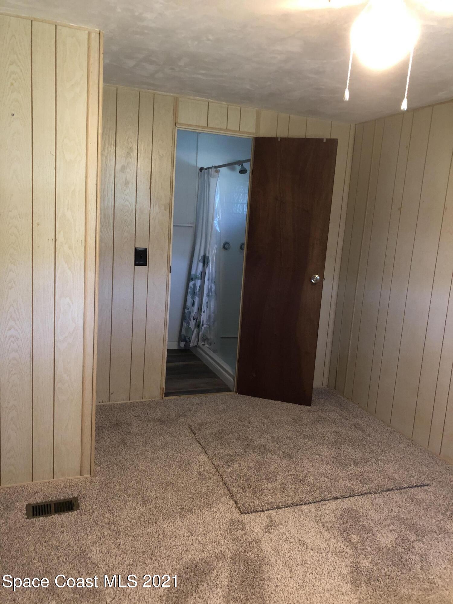 401 Hawk Drive Sebastian, FL 32976 - Photo 14 of 23 an empty room with wooden floor