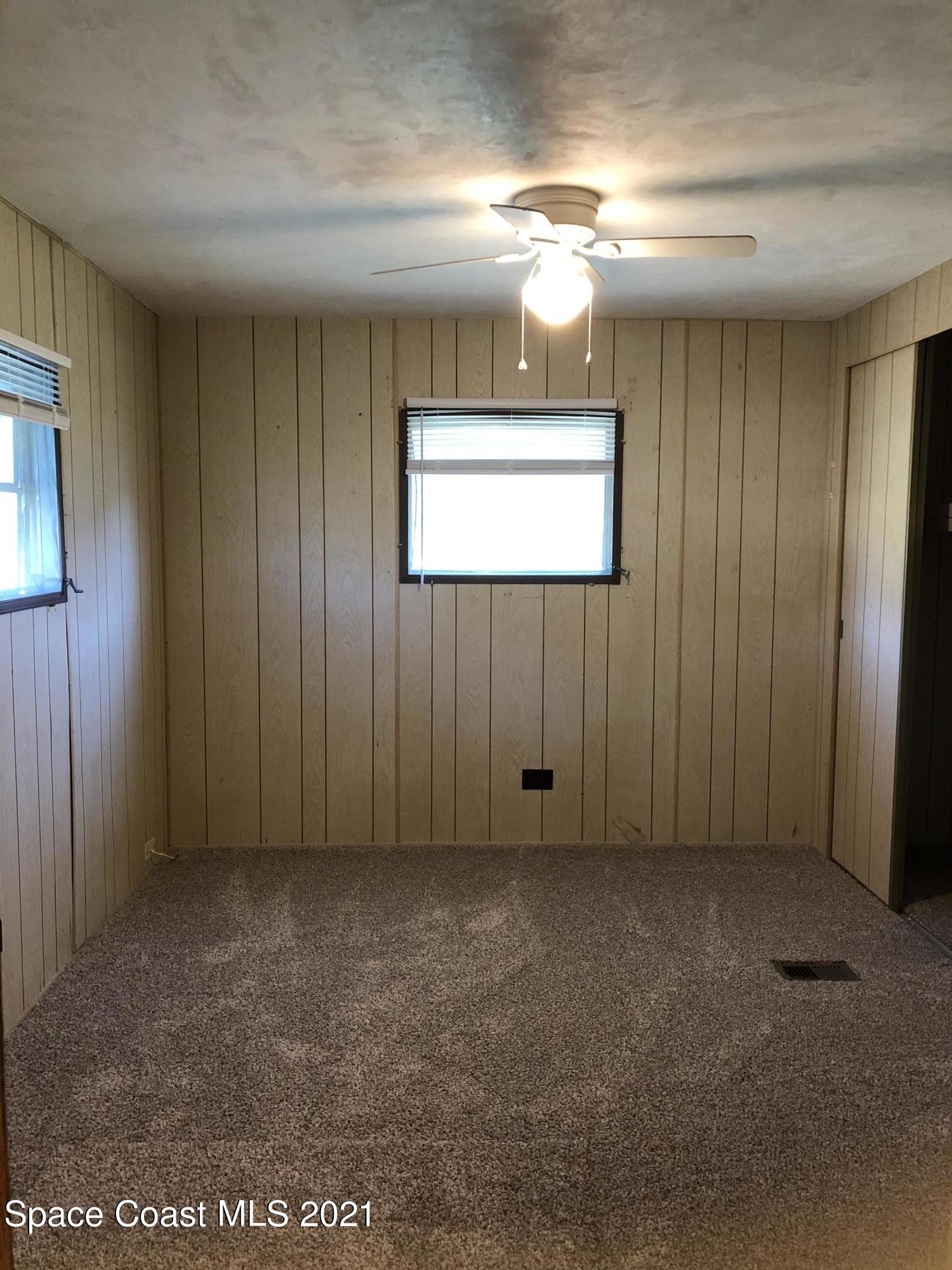 401 Hawk Drive Sebastian, FL 32976 - Photo 15 of 23 a view of an empty room and chandelier fan