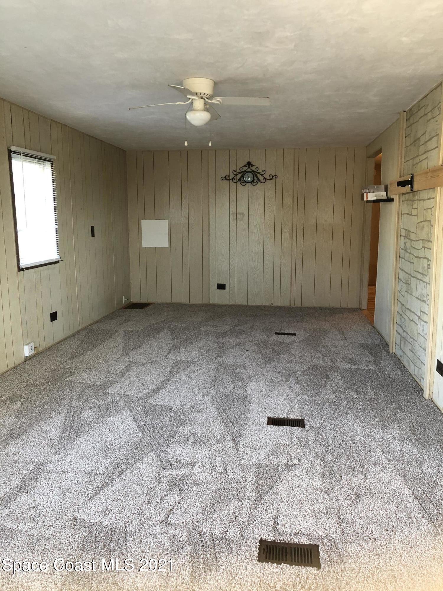 401 Hawk Drive Sebastian, FL 32976 - Photo 3 of 23 en empty room with windows