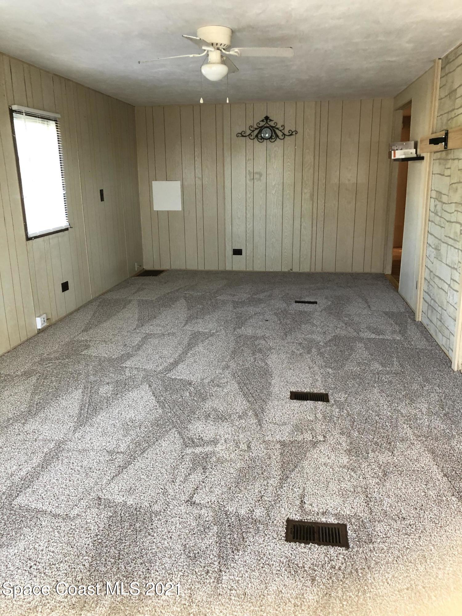 401 Hawk Drive Sebastian, FL 32976 - Photo 21 of 23 en empty room with windows