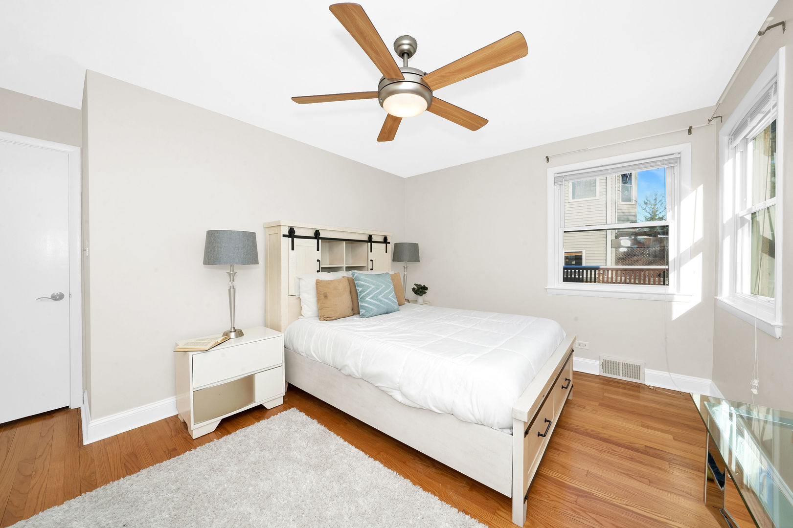 617 South Western Avenue Park Ridge, IL 60068 - Photo 17 of 40 a bedroom with a bed and a ceiling fan