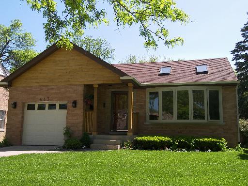 617 South Western Avenue Park Ridge, IL 60068 - Photo 2 of 40 a view of a house with brick walls and a yard with plants