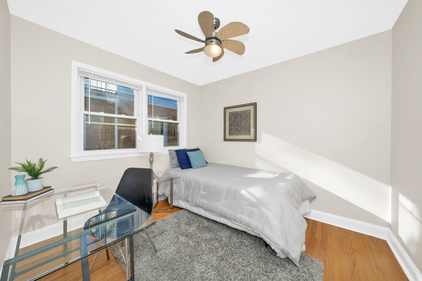 617 South Western Avenue Park Ridge, IL 60068 - Photo 21 of 40 a bedroom with a bed and a chandelier