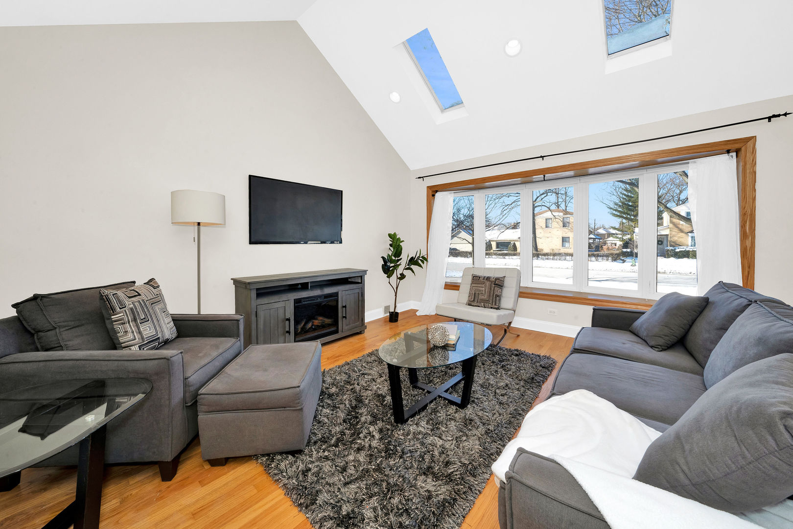617 South Western Avenue Park Ridge, IL 60068 - Photo 6 of 40 a living room with fireplace furniture and a flat screen tv