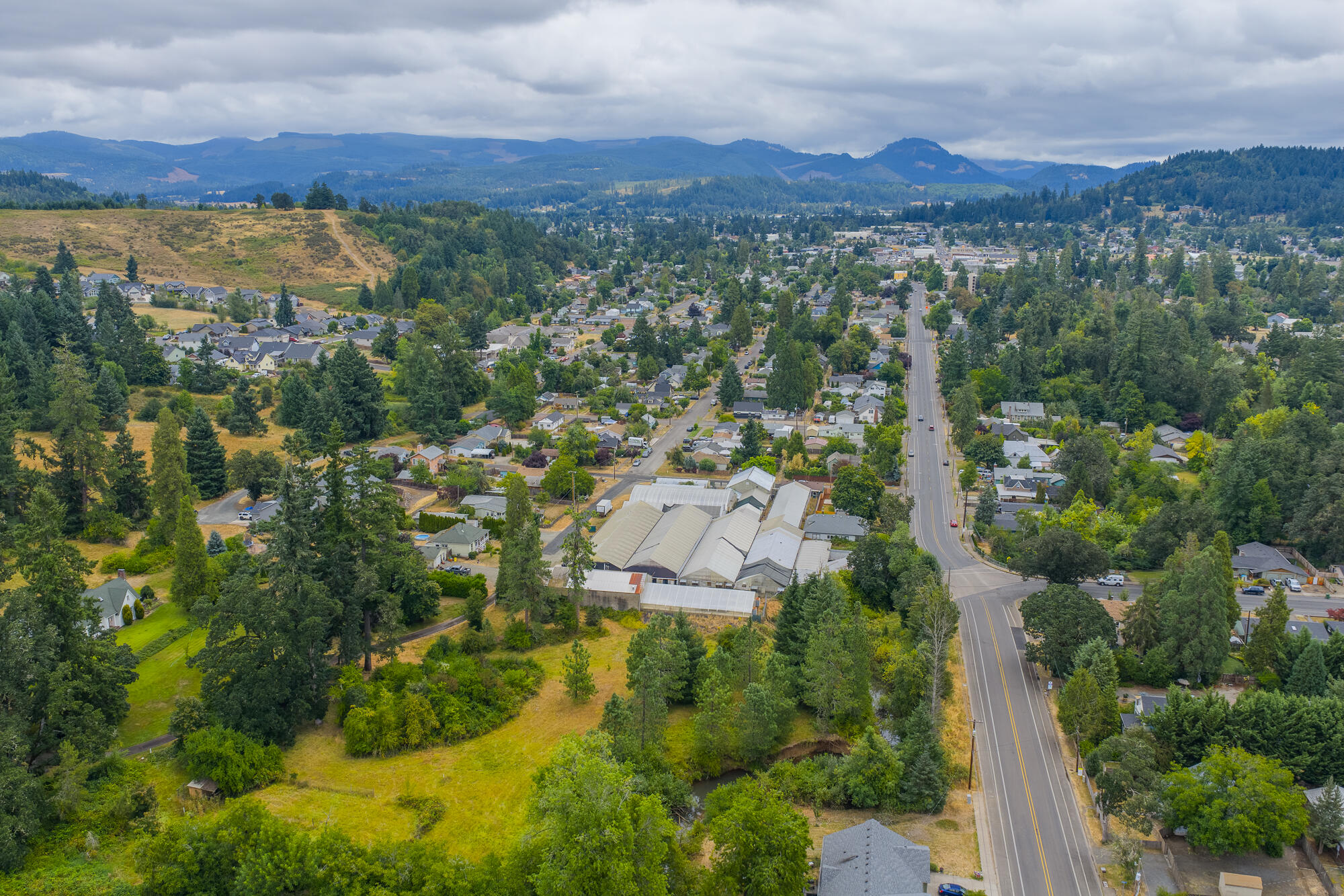 55 Q Street Cottage Grove, OR 97424 - Photo 2 of 36 an aerial view of residential house and outdoor space
