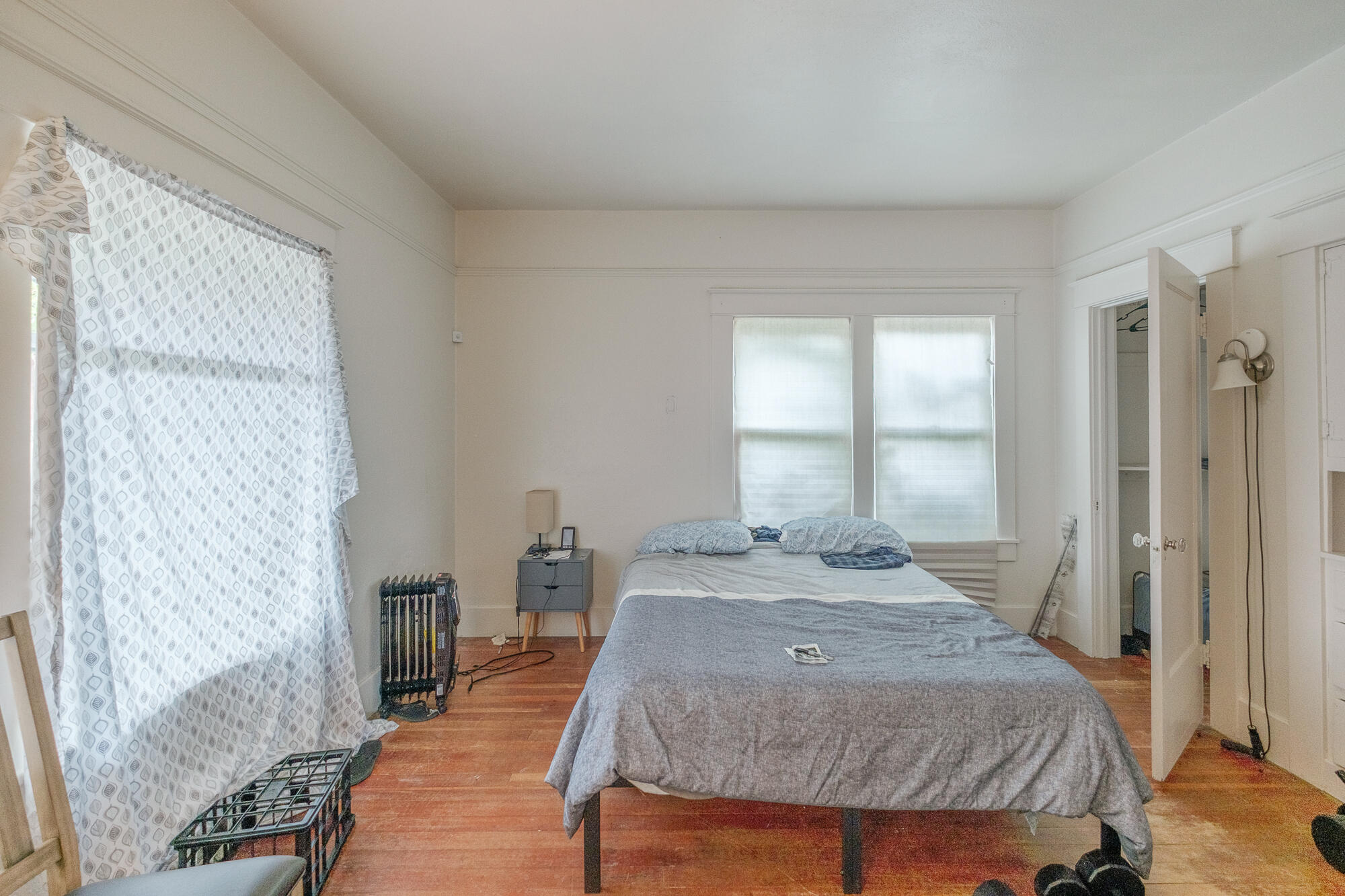 55 Q Street Cottage Grove, OR 97424 - Photo 33 of 36 a bedroom with a bed and wooden floor