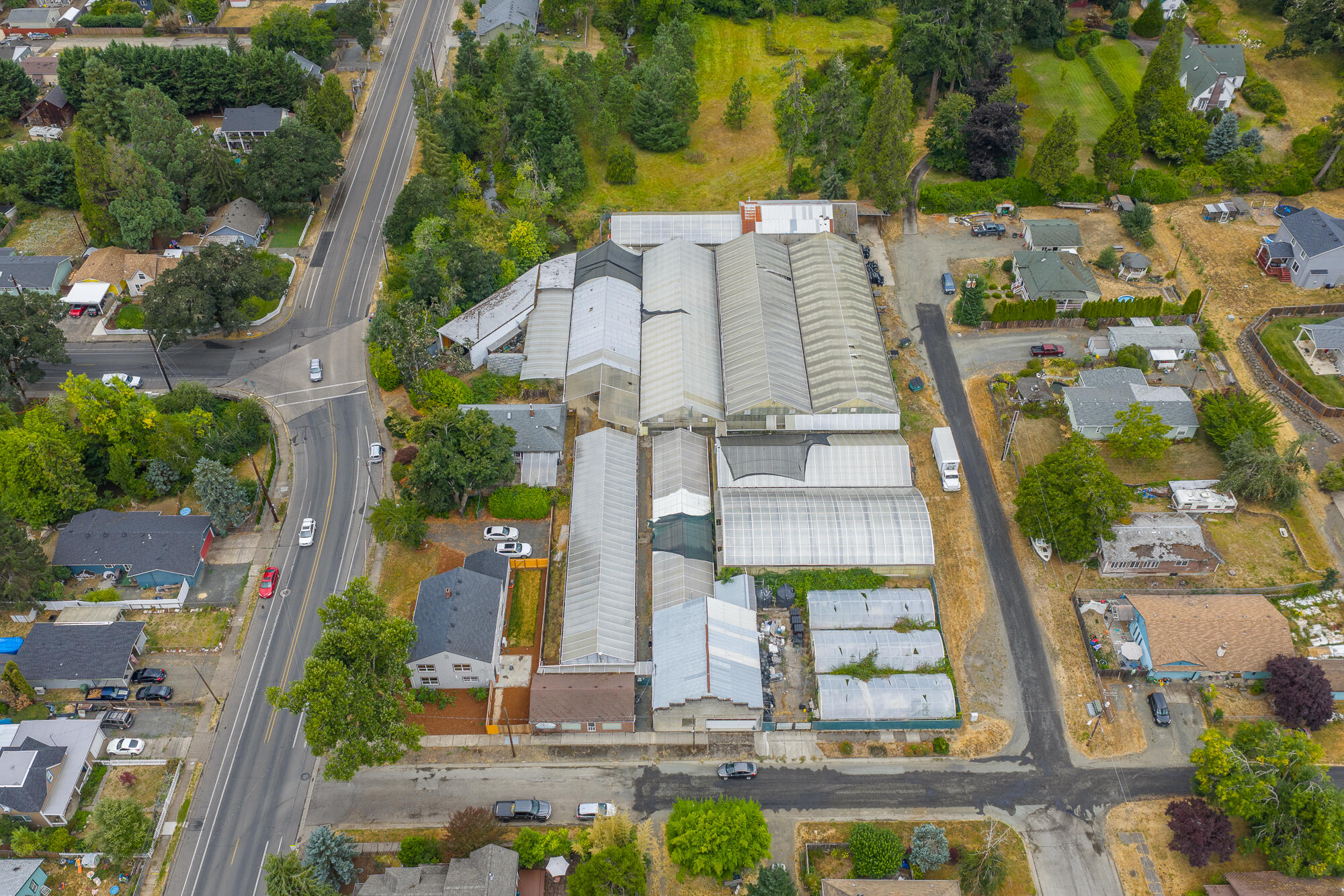 55 Q Street Cottage Grove, OR 97424 - Photo 5 of 36 an aerial view of residential houses with outdoor space and street view