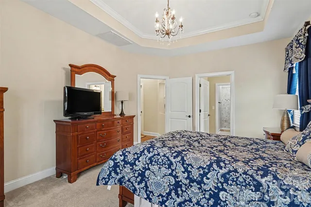 a view of walk in closet with clothes