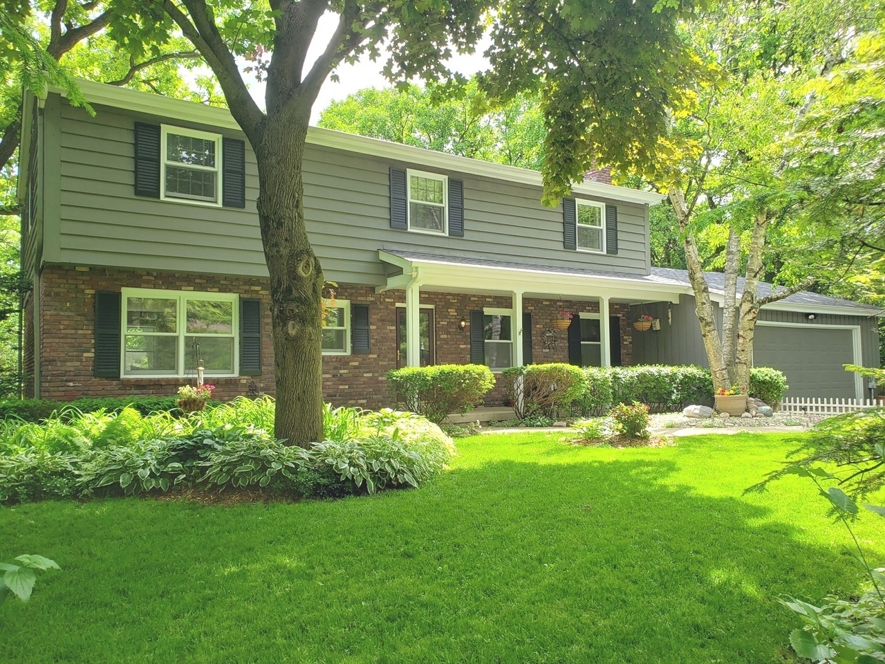 Undisclosed Address Cary, IL 60013 - Photo 1 of 1 a front view of house with yard and green space