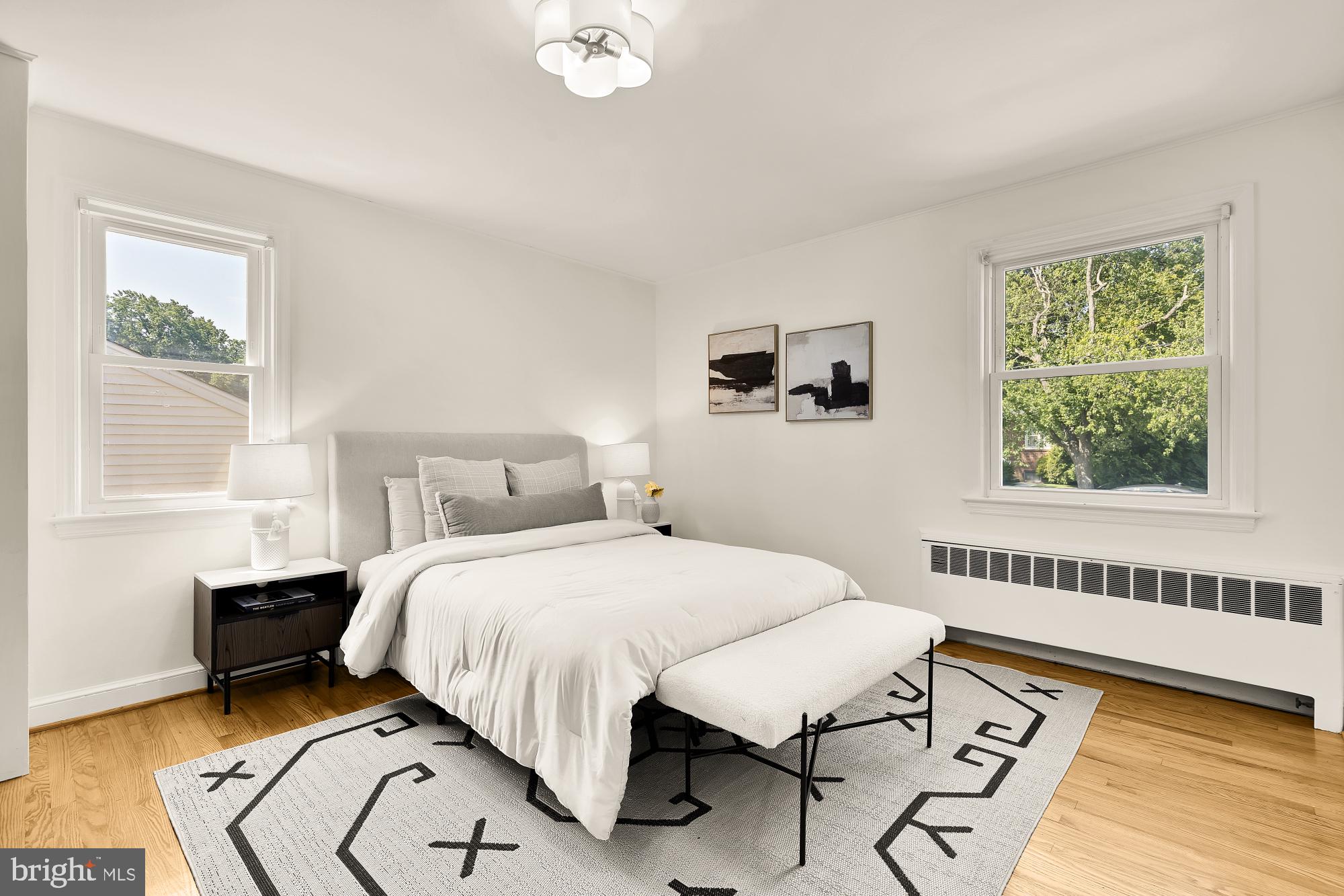 8921 Whitney Street Silver Spring, MD 20901 - Photo 13 of 27 a bedroom with a bed and a window