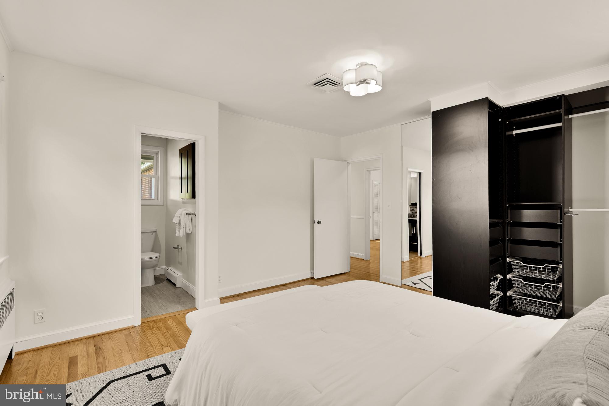 8921 Whitney Street Silver Spring, MD 20901 - Photo 14 of 27 a bedroom with a bed and a walk in closet