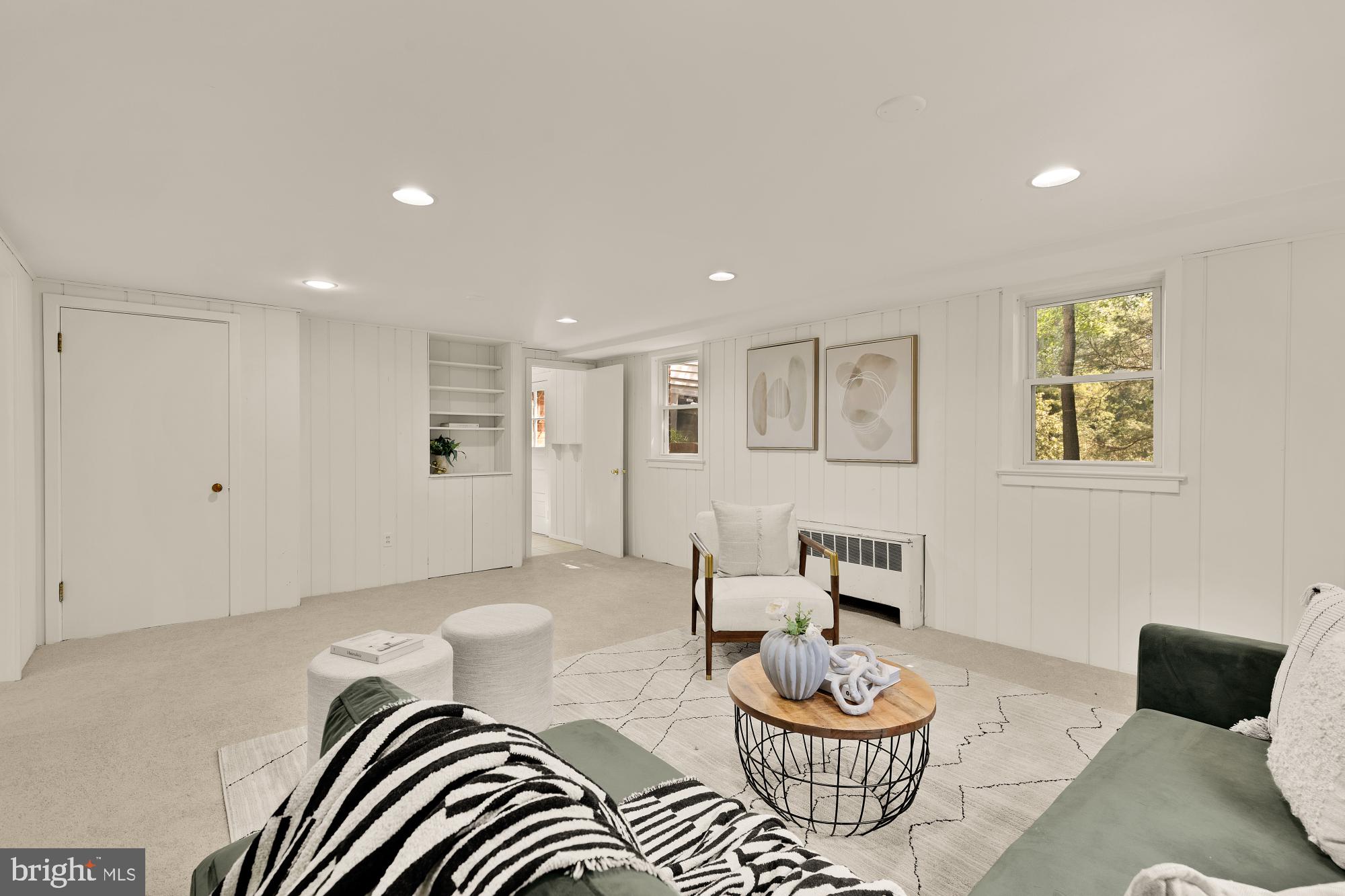 8921 Whitney Street Silver Spring, MD 20901 - Photo 20 of 27 a living room with furniture and a lamp