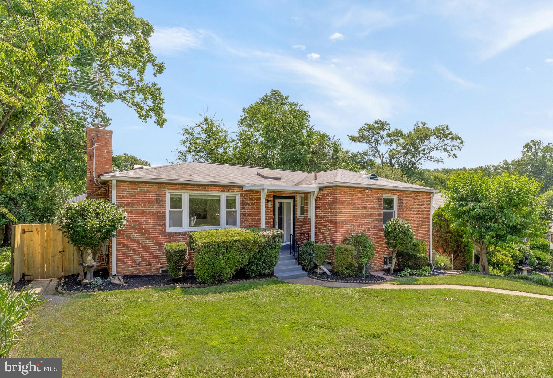 8921 Whitney Street Silver Spring, MD 20901 - Photo 2 of 27 front view of a house with a yard