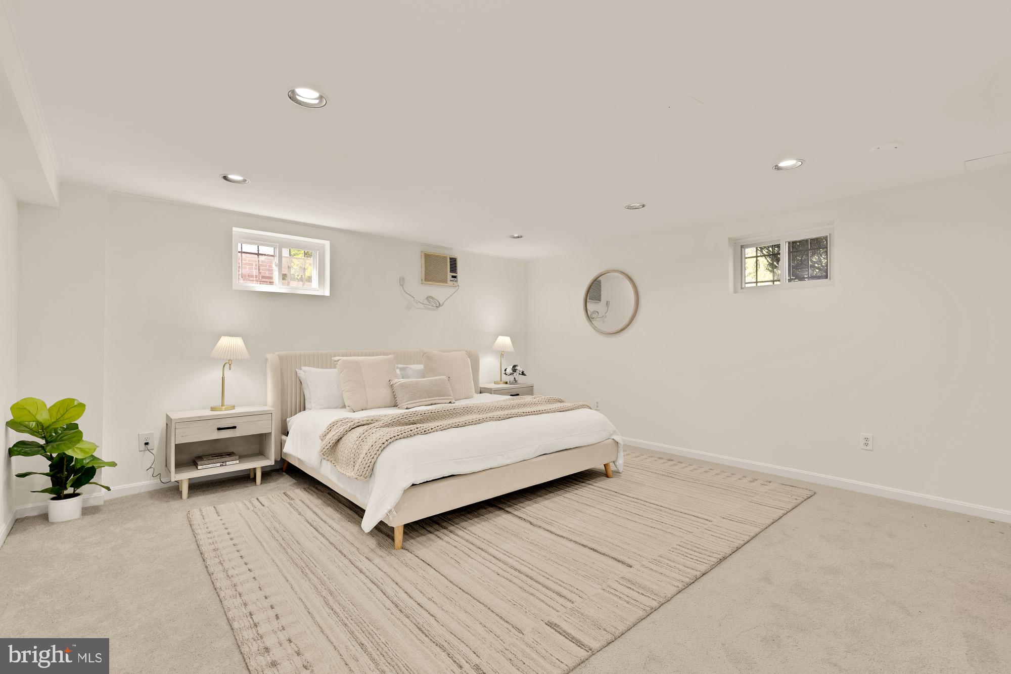 8921 Whitney Street Silver Spring, MD 20901 - Photo 22 of 27 a bedroom with a bed and a lamp