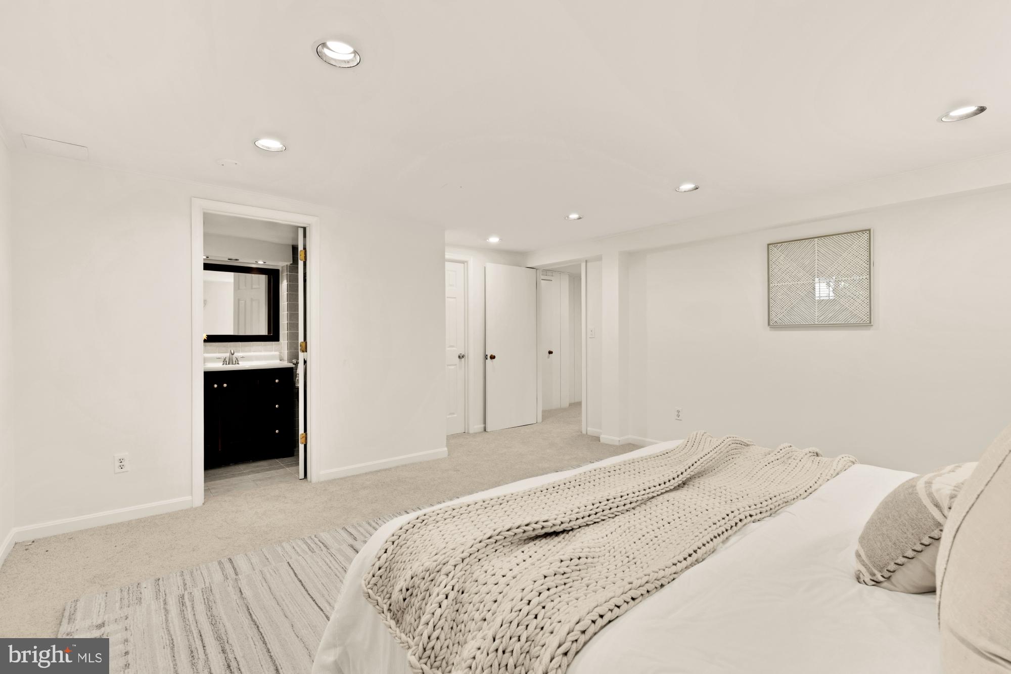 8921 Whitney Street Silver Spring, MD 20901 - Photo 23 of 27 a bedroom with a bed and a window