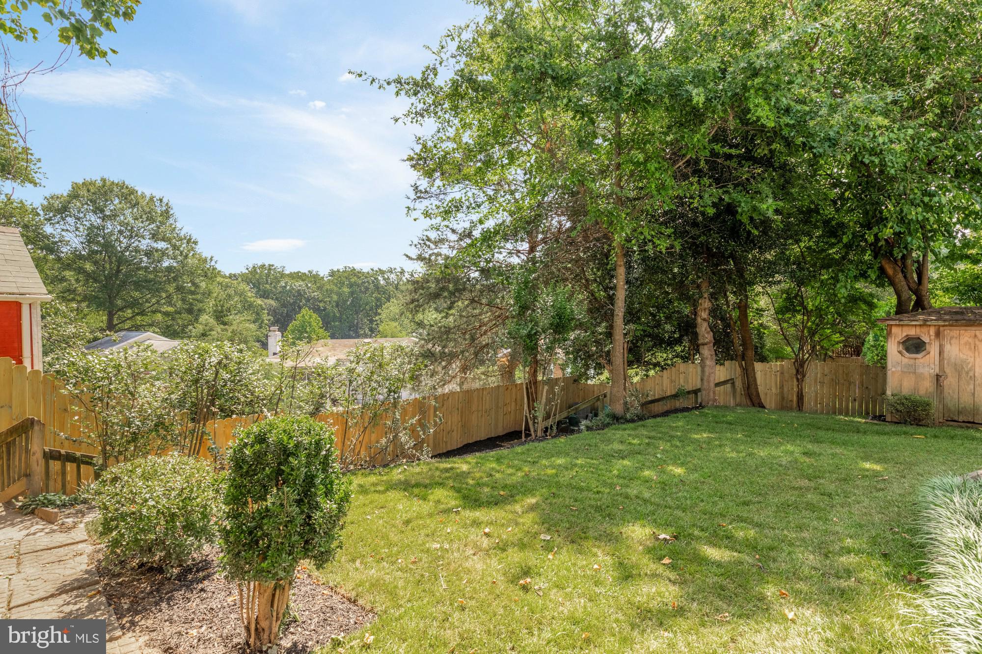 8921 Whitney Street Silver Spring, MD 20901 - Photo 25 of 27 a view of a yard with large trees