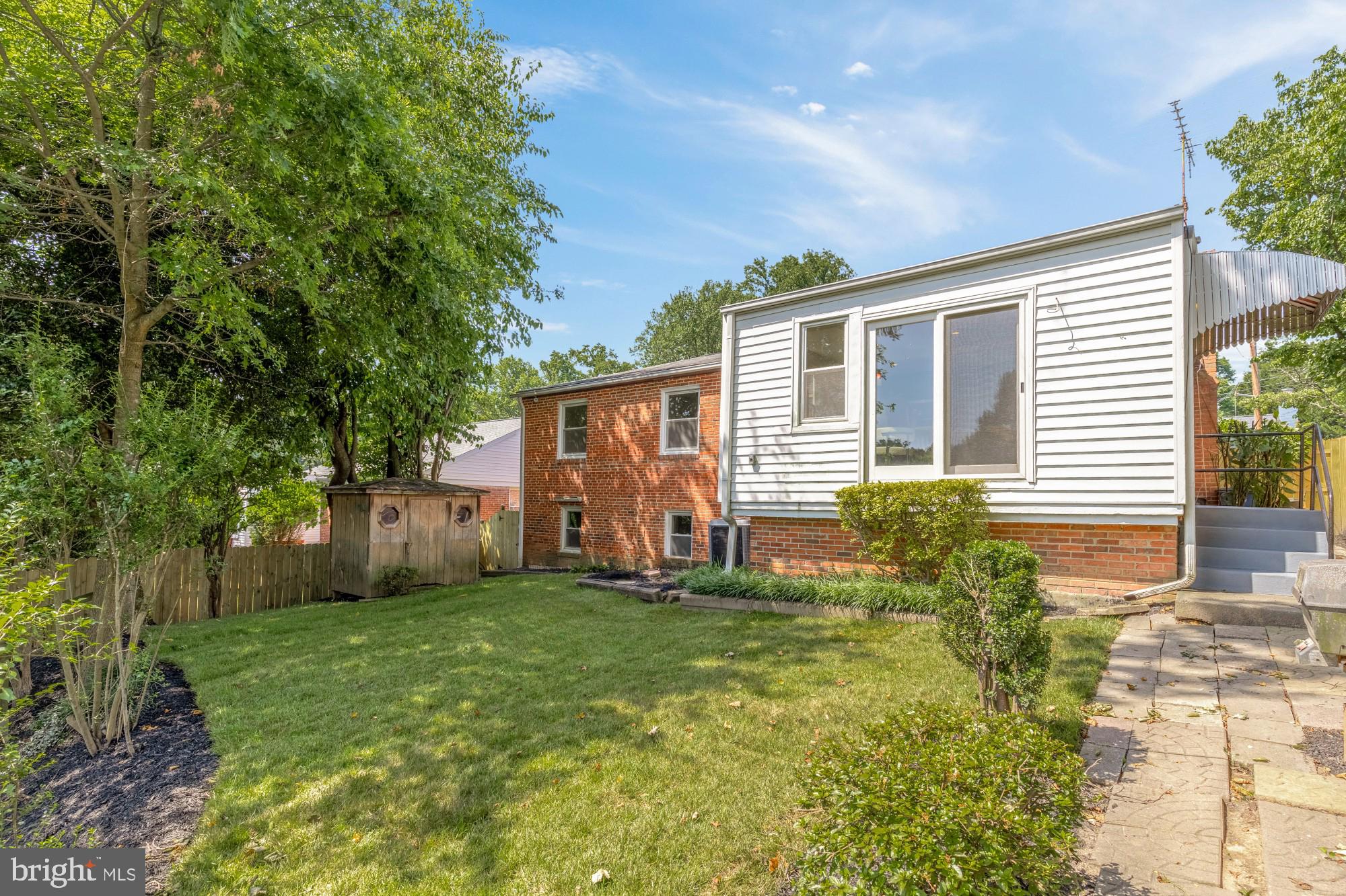 8921 Whitney Street Silver Spring, MD 20901 - Photo 26 of 27 a view of a house with backyard and sitting area