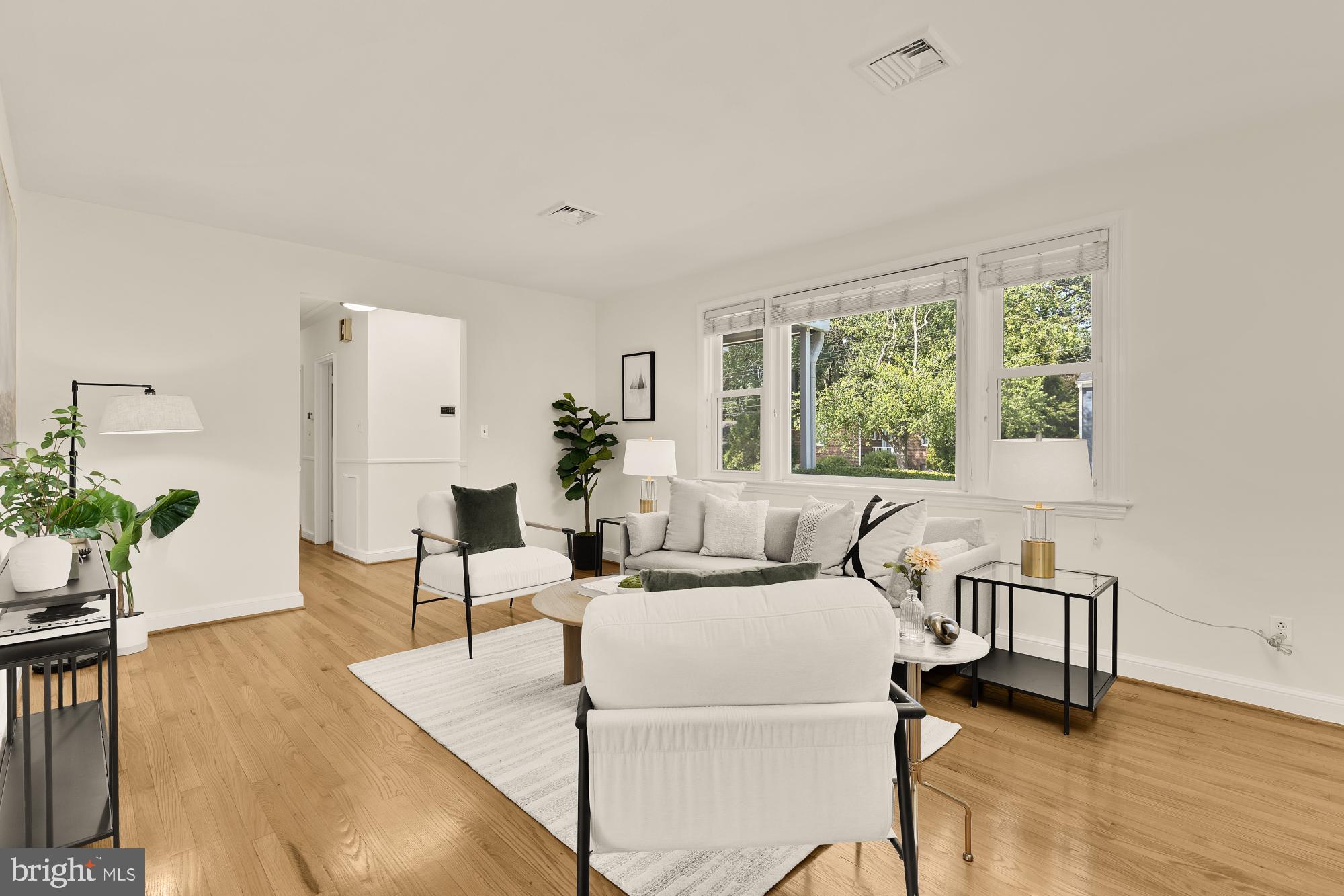 8921 Whitney Street Silver Spring, MD 20901 - Photo 4 of 27 a living room with furniture and a large window
