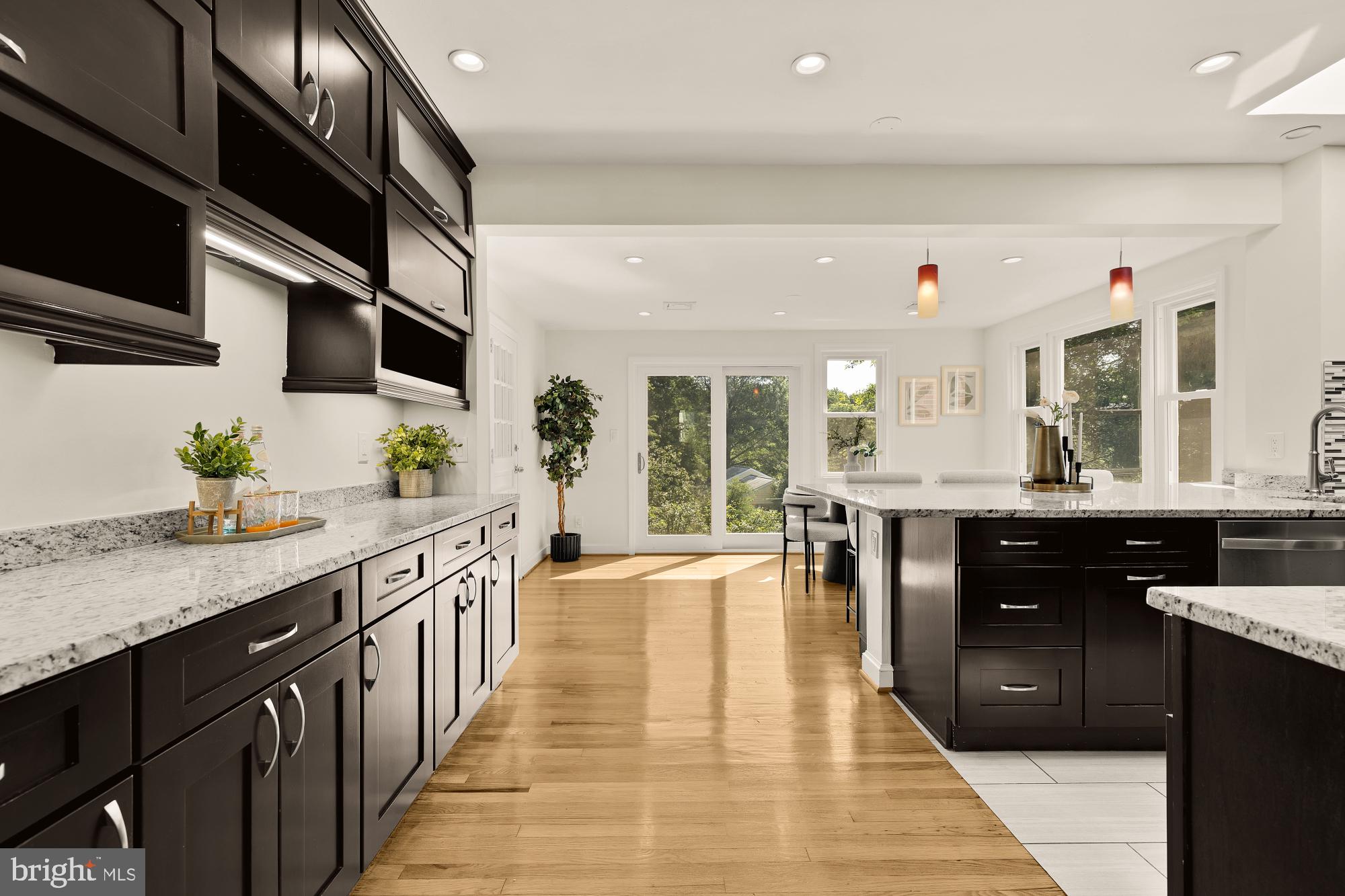 8921 Whitney Street Silver Spring, MD 20901 - Photo 6 of 27 a kitchen with stainless steel appliances granite countertop a sink counter space cabinets and a window