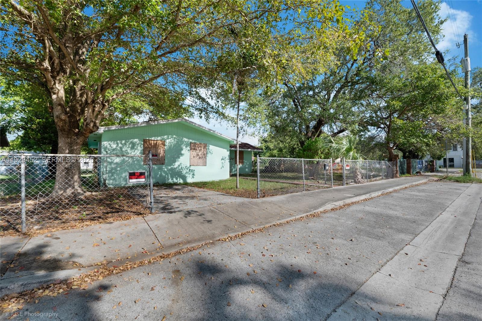 3715 Oak Avenue Miami, FL 33133 - Photo 11 of 26 a view of a street with a large trees