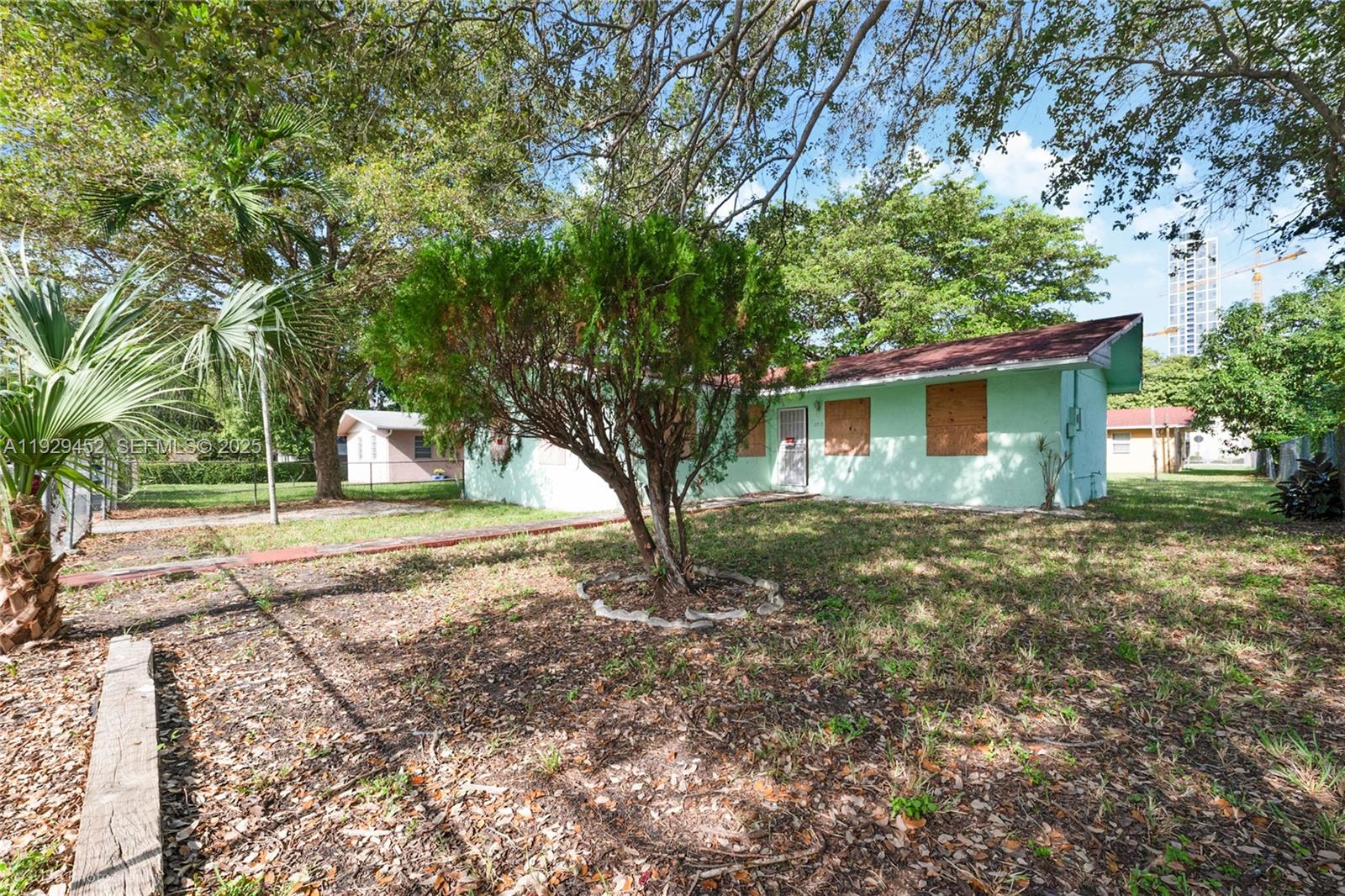 3715 Oak Avenue Miami, FL 33133 - Photo 14 of 26 a view of a house with yard and tree s