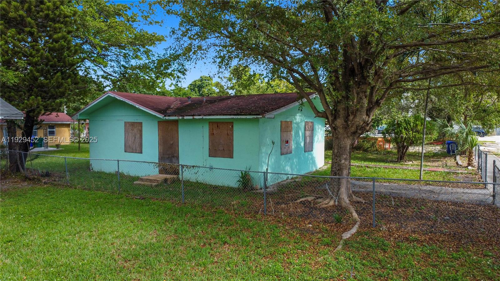3715 Oak Avenue Miami, FL 33133 - Photo 21 of 26 a view of a house with a yard and tree
