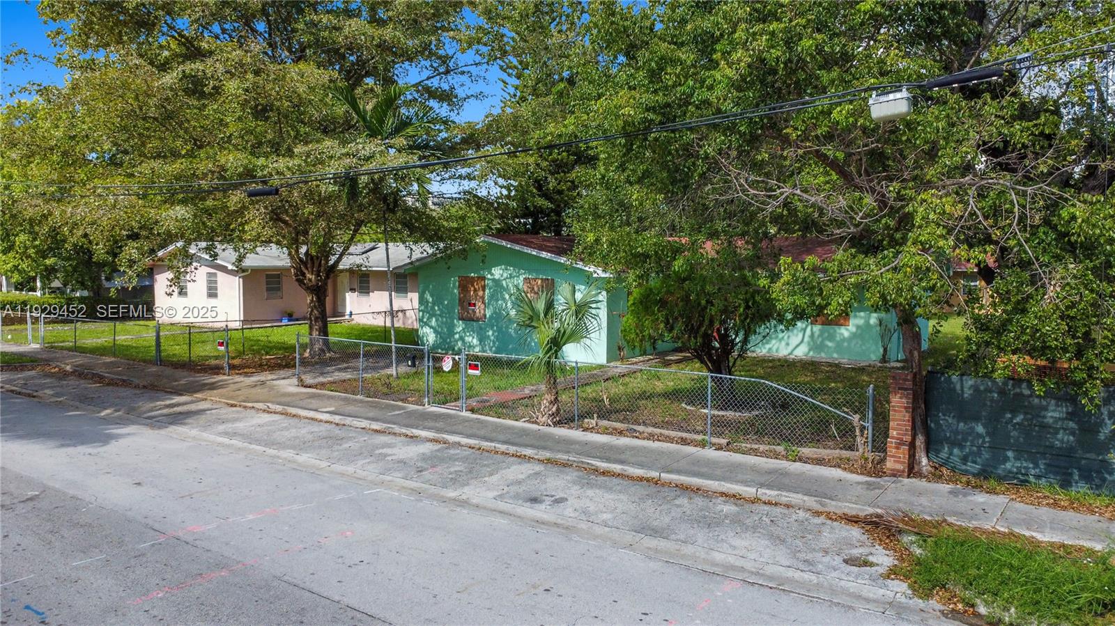 3715 Oak Avenue Miami, FL 33133 - Photo 22 of 26 a view of a house with a tree in the background