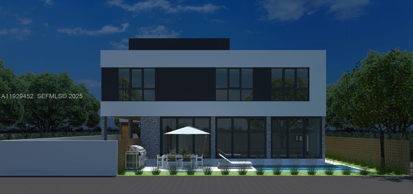 3715 Oak Avenue Miami, FL 33133 - Photo 4 of 26 a front view of a house with a yard