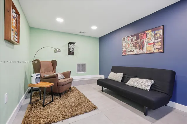 a living room with furniture and rug