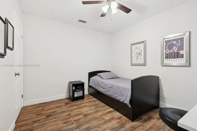 a bedroom with a bed and a chair