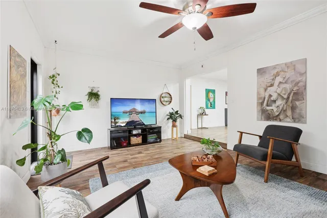 a living room with furniture and a rug