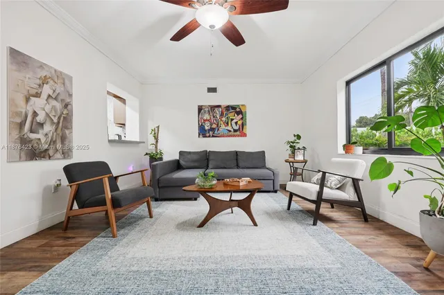 a living room with furniture and a rug