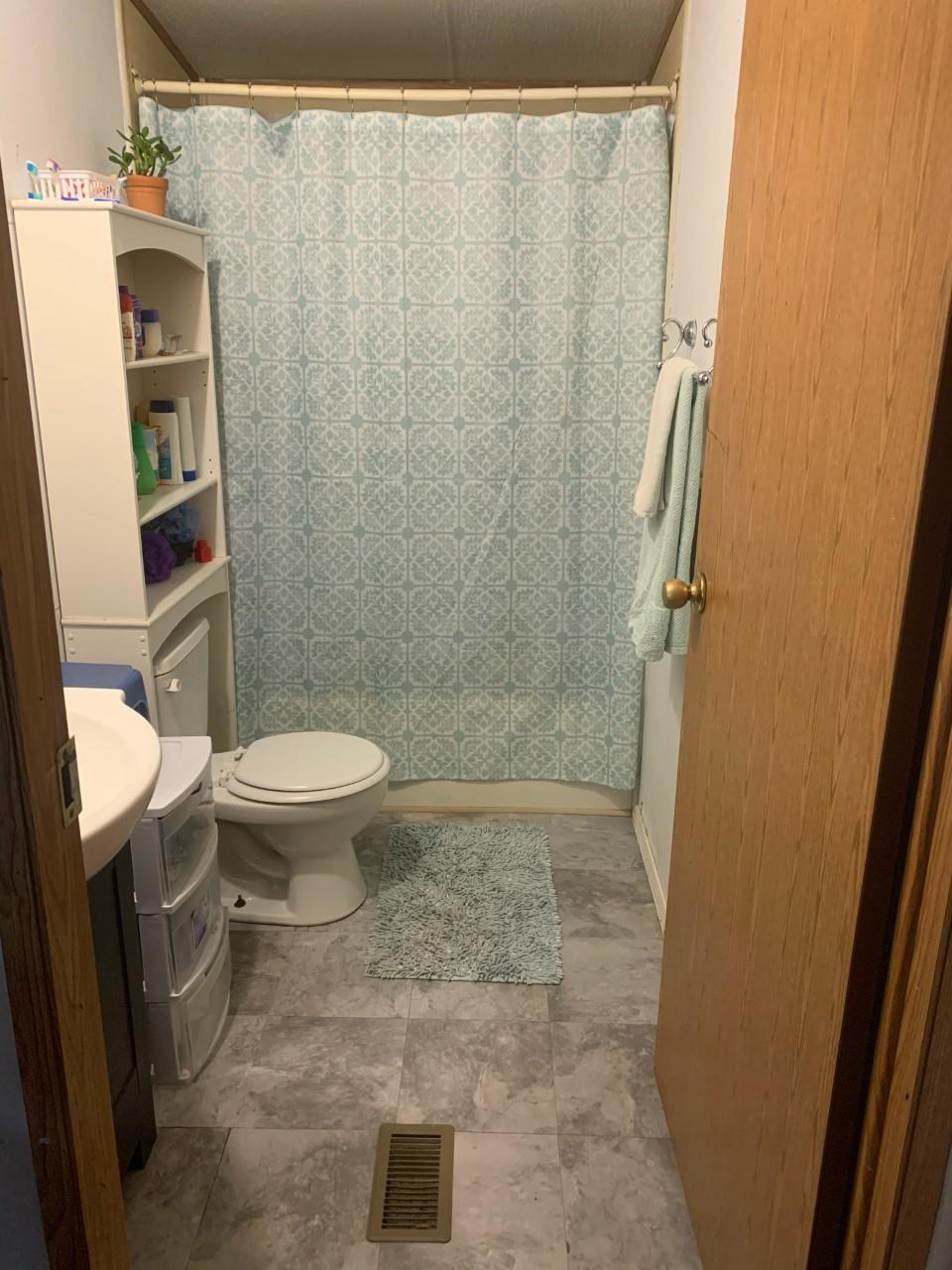 1073 Friendship Road Shawsville, VA 24162 - Photo 3 of 11 a bathroom with a toilet and a shower