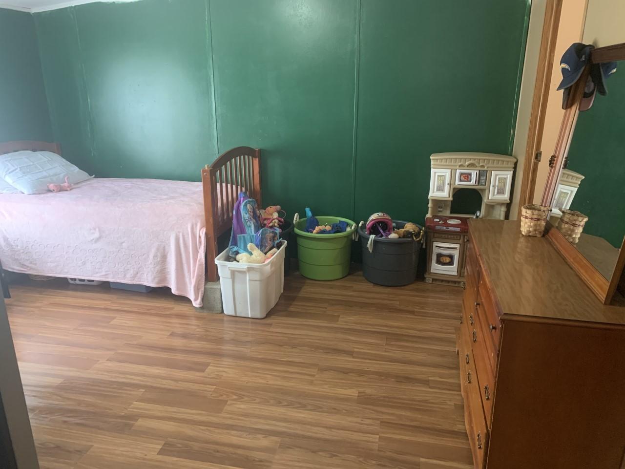 1073 Friendship Road Shawsville, VA 24162 - Photo 4 of 11 a bedroom with a bed and a mirror