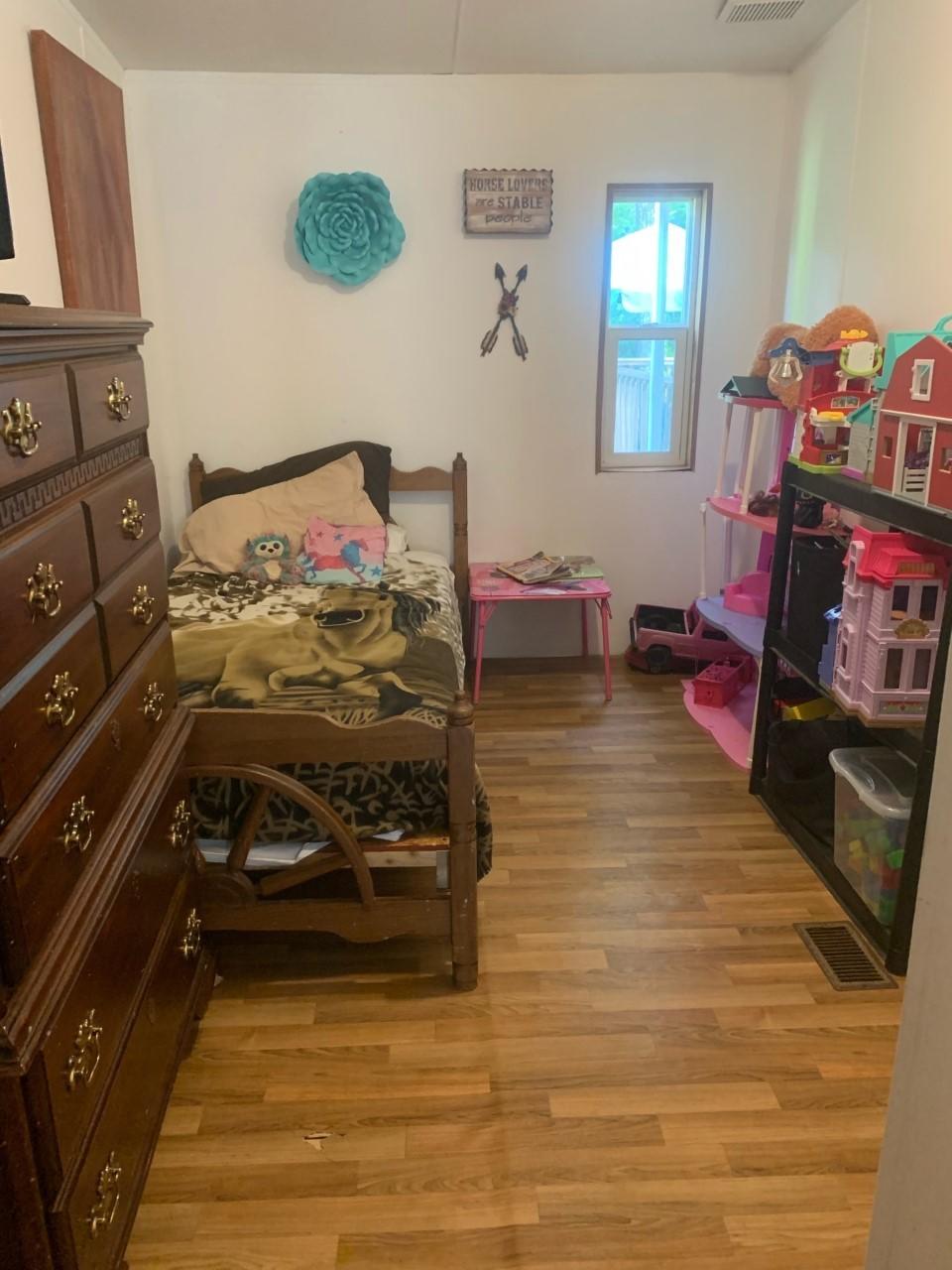 1073 Friendship Road Shawsville, VA 24162 - Photo 5 of 11 a bedroom with a bed and a tv on the dresser