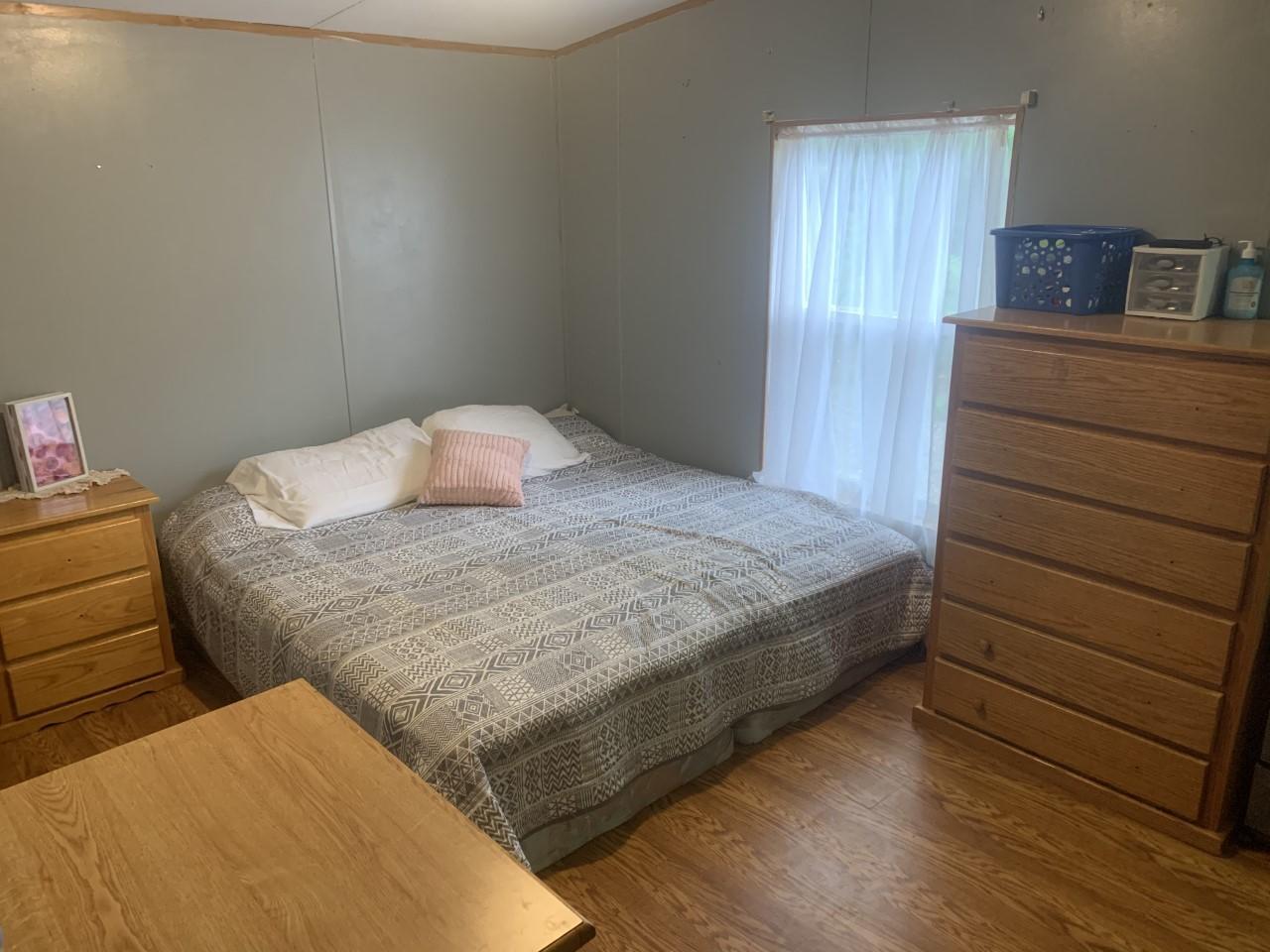 1073 Friendship Road Shawsville, VA 24162 - Photo 9 of 11 a bedroom with a bed and a dresser