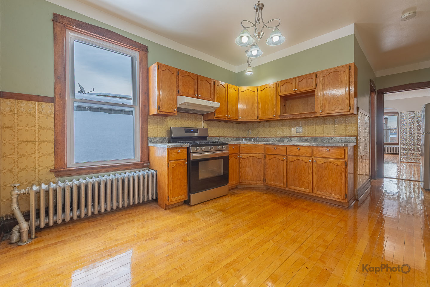 3530 West Evergreen Avenue, Unit 2 Chicago, IL 60651 - Photo 12 of 25 a kitchen with stainless steel appliances granite countertop a stove sink and cabinets