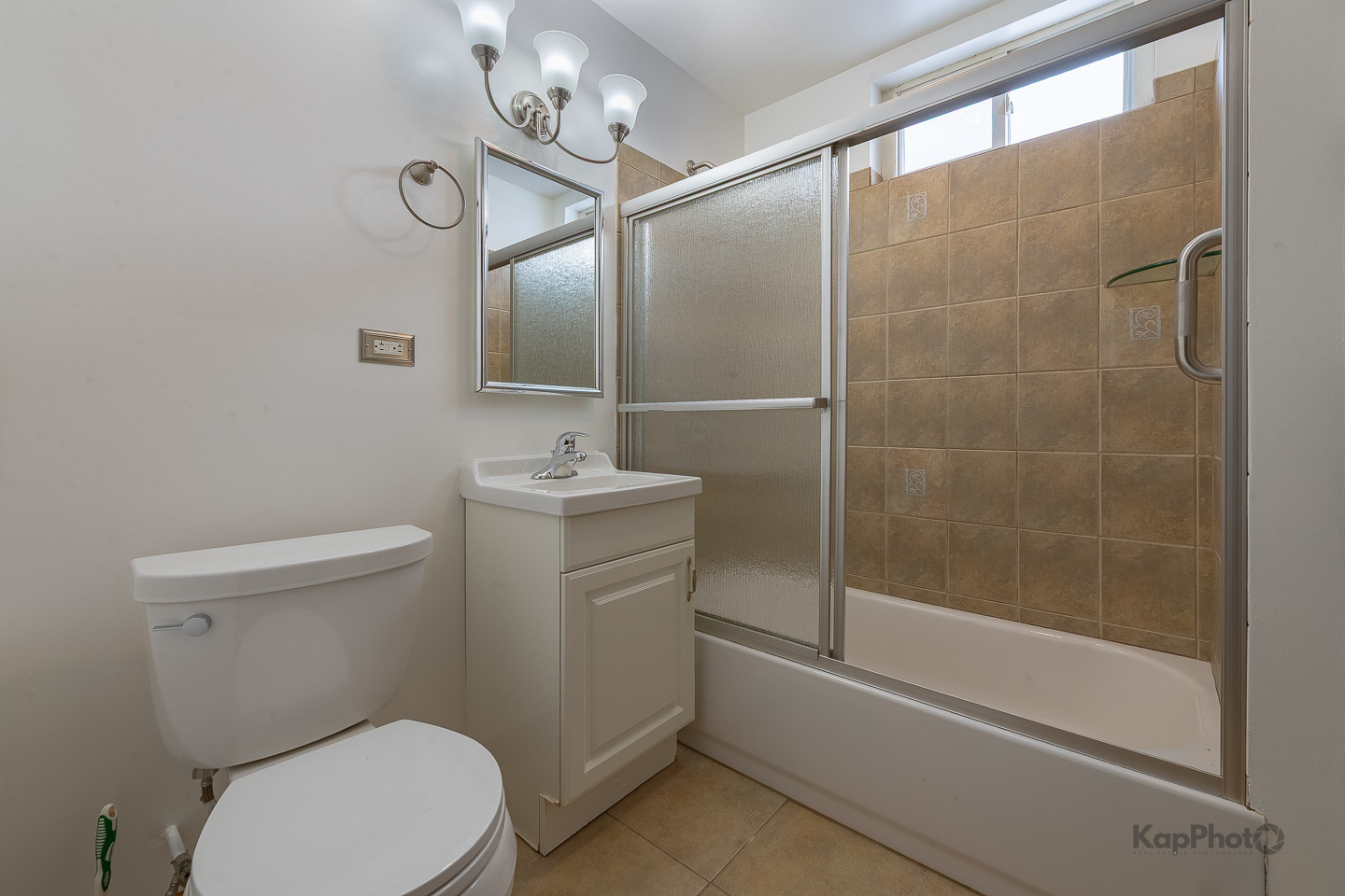 3530 West Evergreen Avenue, Unit 2 Chicago, IL 60651 - Photo 21 of 25 a bathroom with a toilet a sink and shower