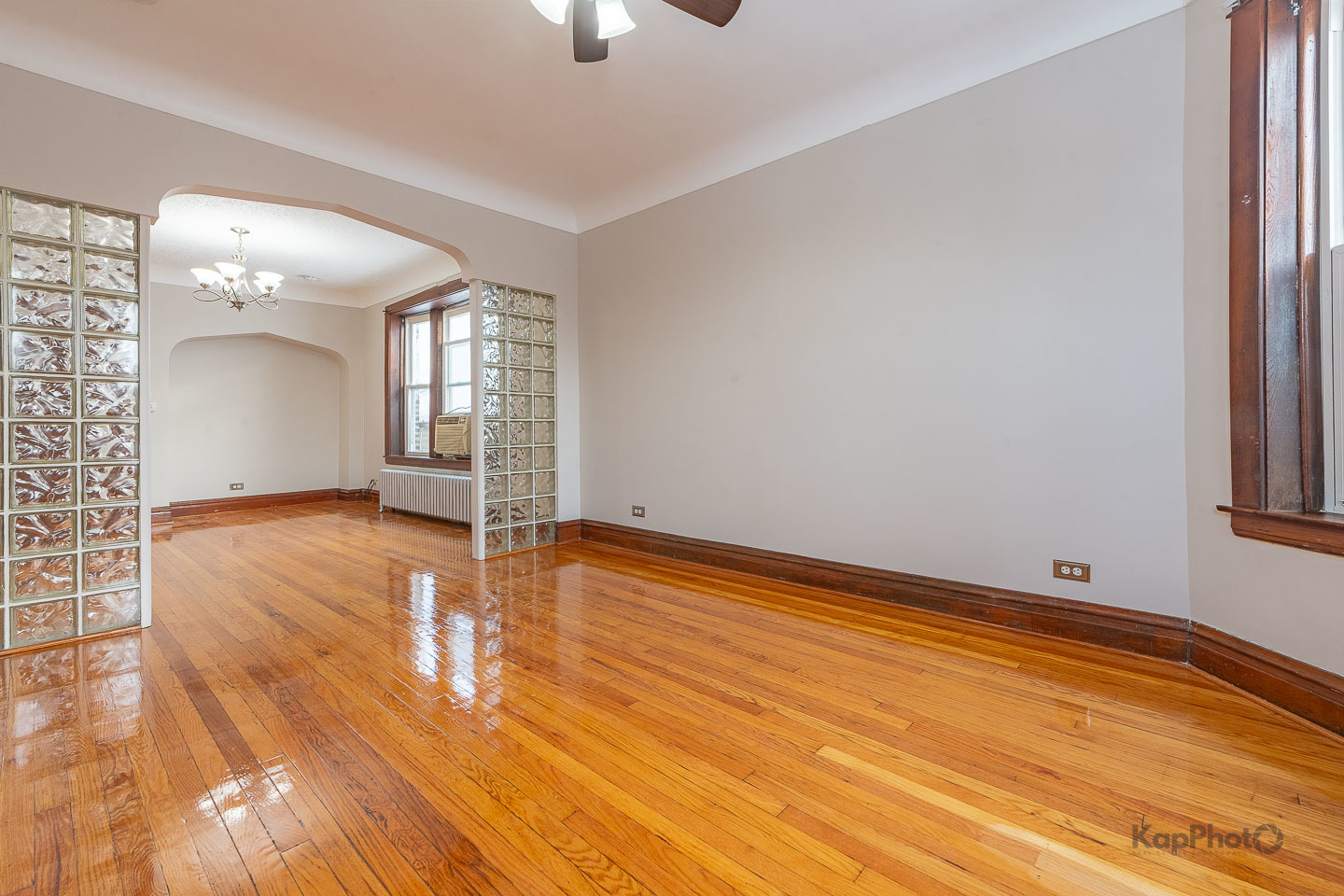 3530 West Evergreen Avenue, Unit 2 Chicago, IL 60651 - Photo 3 of 25 wooden floor in an empty room with a window