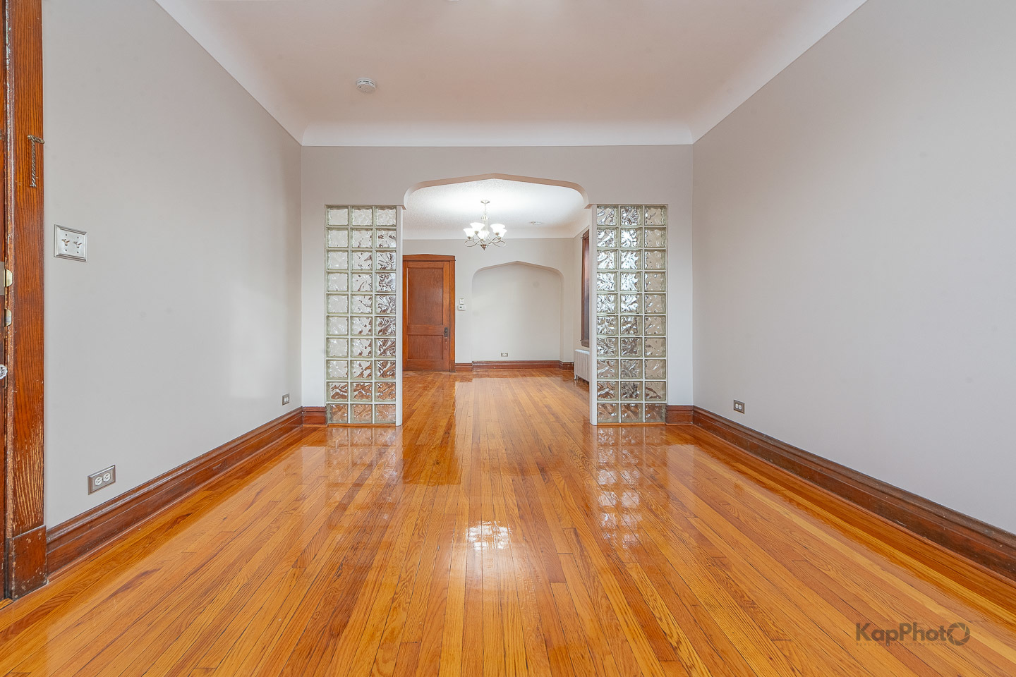 3530 West Evergreen Avenue, Unit 2 Chicago, IL 60651 - Photo 5 of 25 a view of a room with wooden floor and white walls