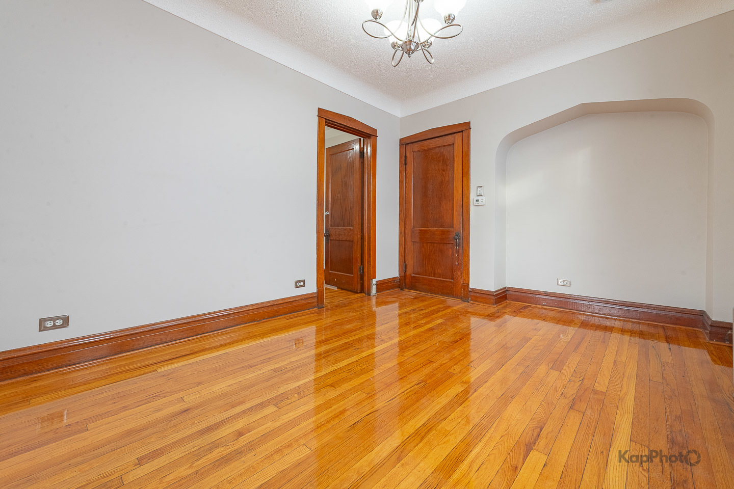 3530 West Evergreen Avenue, Unit 2 Chicago, IL 60651 - Photo 9 of 25 a view of an empty room with wooden floor and a window