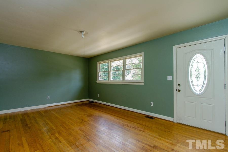 3832 Corwin Road Garner, NC 27529 - Photo 12 of 21 a view of a room with wooden floor and windows