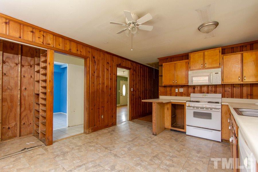 3832 Corwin Road Garner, NC 27529 - Photo 17 of 21 a view of a kitchen with a sink and a window