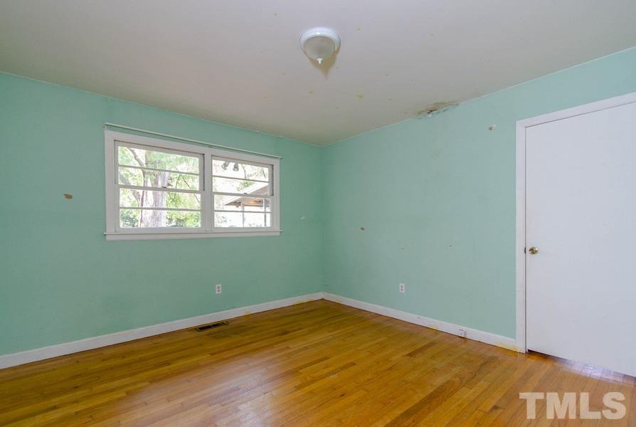3832 Corwin Road Garner, NC 27529 - Photo 18 of 21 a view of a room with wooden floor and windows
