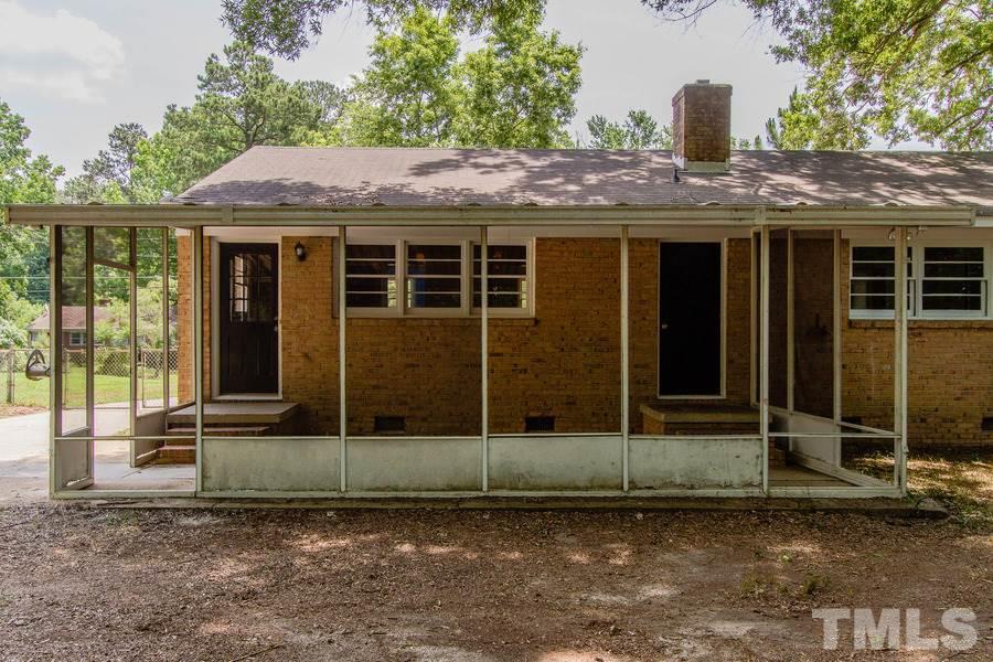 3832 Corwin Road Garner, NC 27529 - Photo 8 of 21 a view of a house with a wooden fence