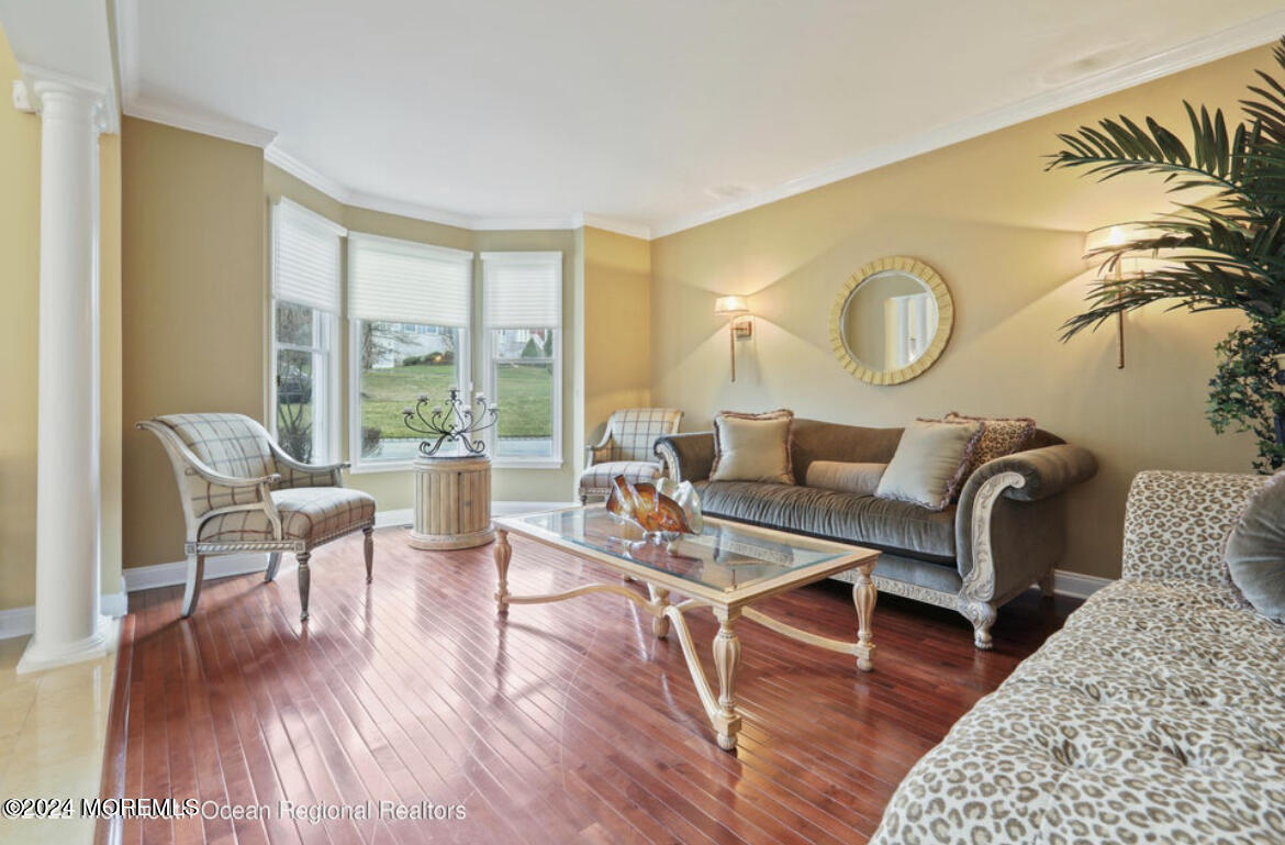 29 Northwoods Road Asbury Park, NJ 07712 - Photo 11 of 34 a living room with furniture and wooden floor
