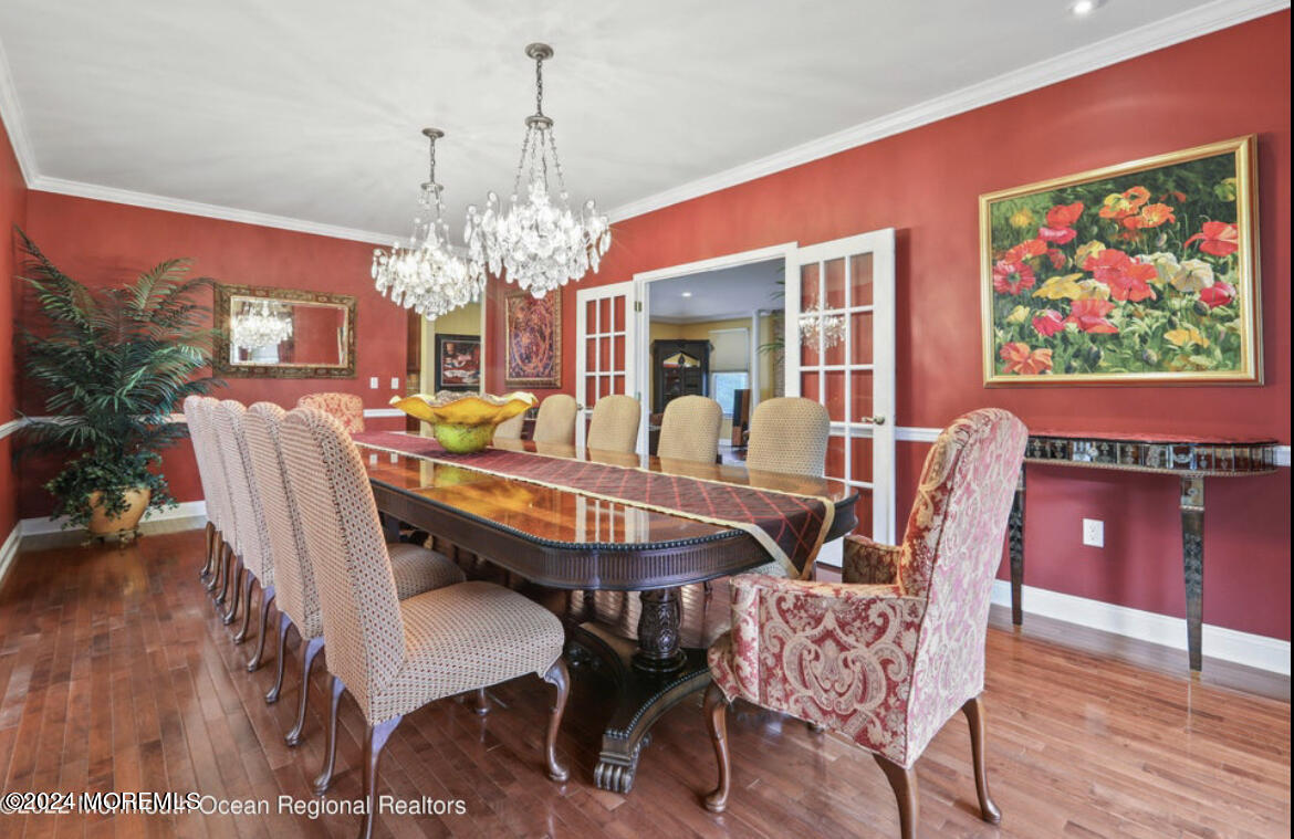 29 Northwoods Road Asbury Park, NJ 07712 - Photo 12 of 34 a view of a dining room with furniture wooden floor and chandelier