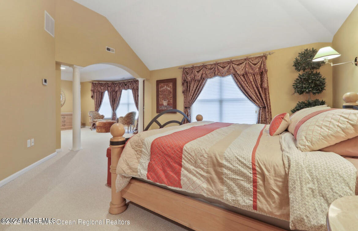 29 Northwoods Road Asbury Park, NJ 07712 - Photo 20 of 34 a bed sitting in a bedroom next to a window