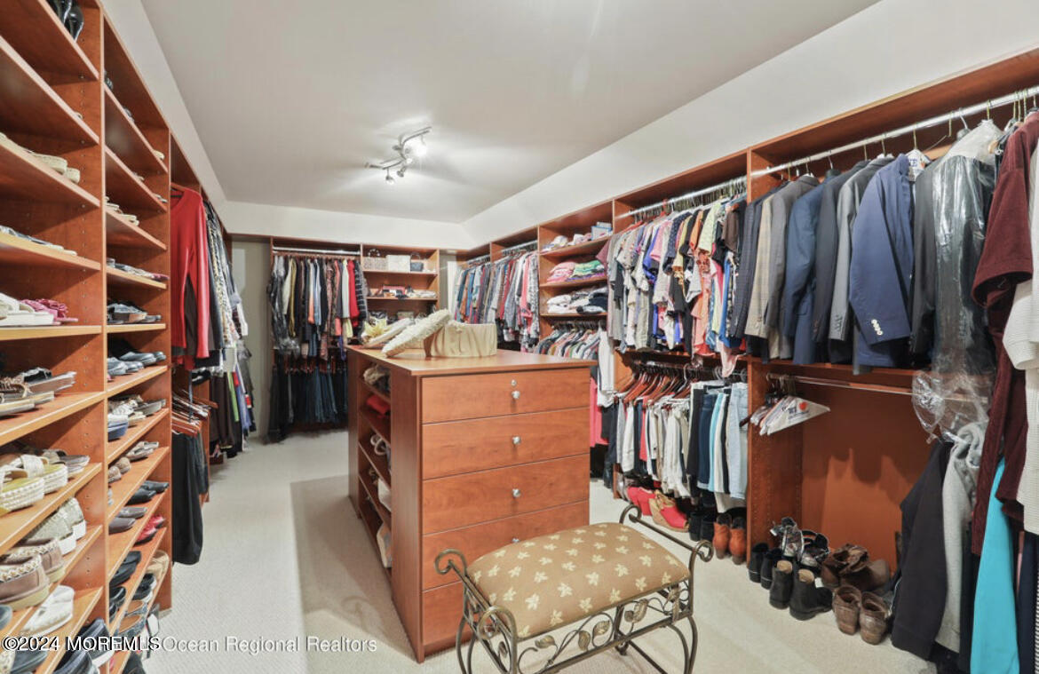29 Northwoods Road Asbury Park, NJ 07712 - Photo 21 of 34 a view of walk in closet with clothes and shoes